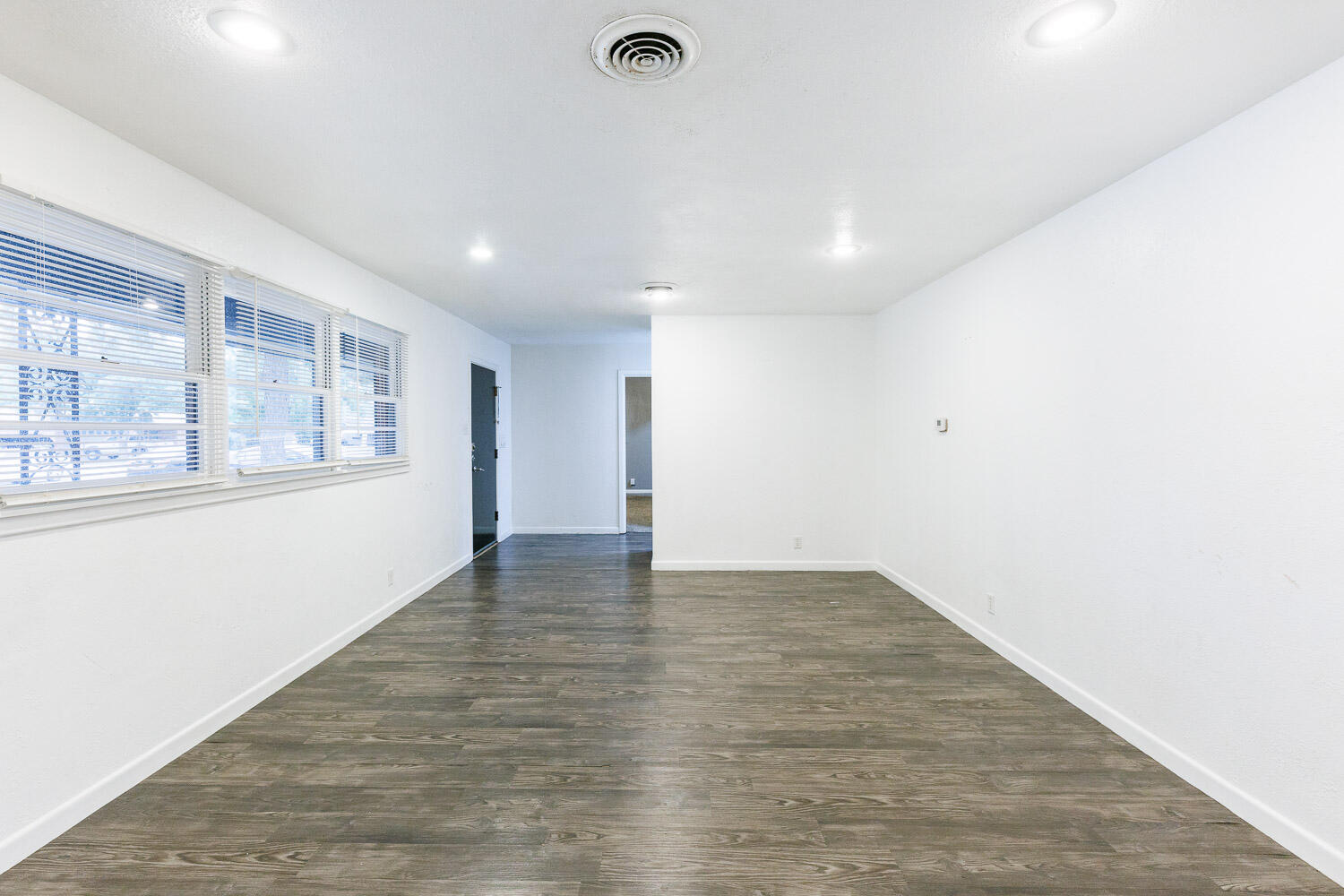 3515 36th Street Lubbock, TX 79413 - Photo 13 of 63 a view of an empty room with a window