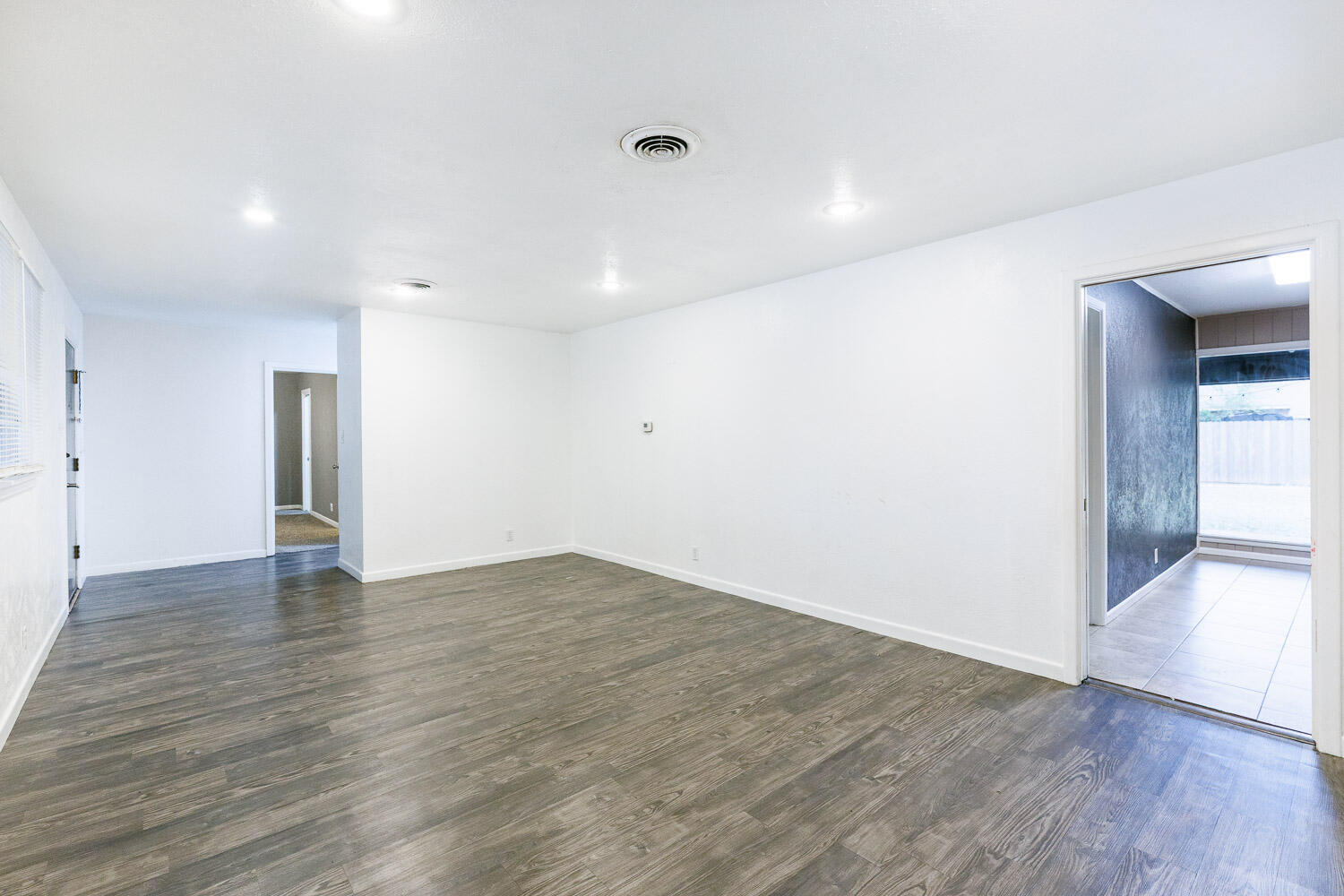 3515 36th Street Lubbock, TX 79413 - Photo 14 of 63 a view of an empty room with wooden floor