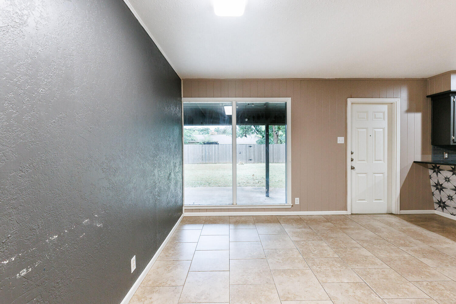 3515 36th Street Lubbock, TX 79413 - Photo 16 of 63 a view of an empty room with a window