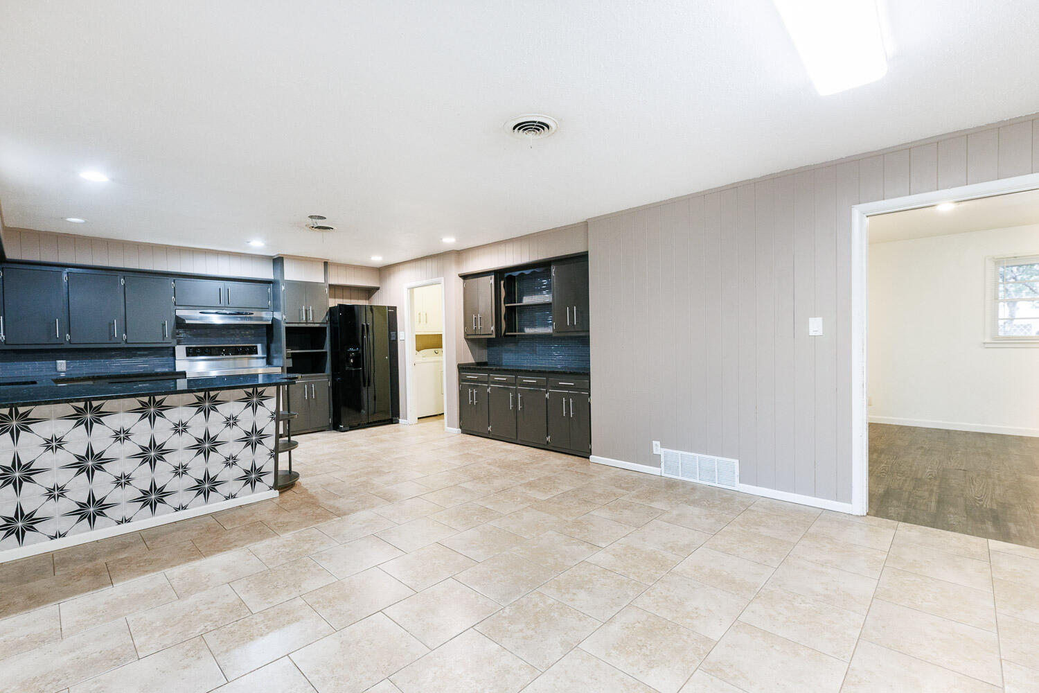 3515 36th Street Lubbock, TX 79413 - Photo 18 of 63 a large kitchen with cabinets and stainless steel appliances