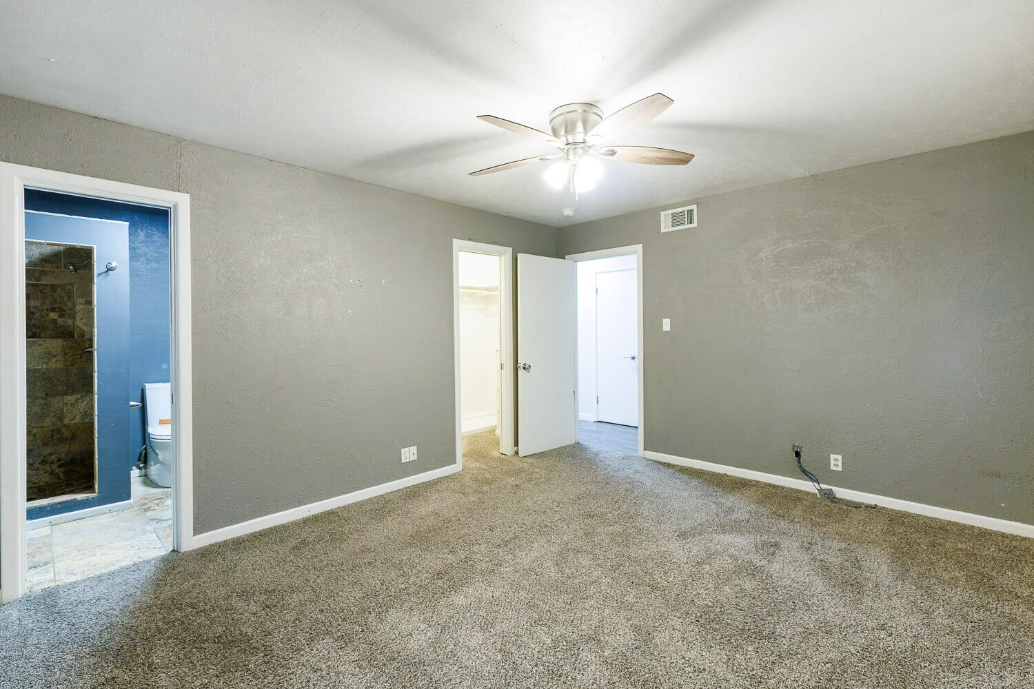 3515 36th Street Lubbock, TX 79413 - Photo 37 of 63 an empty room with closet and a chandelier fan