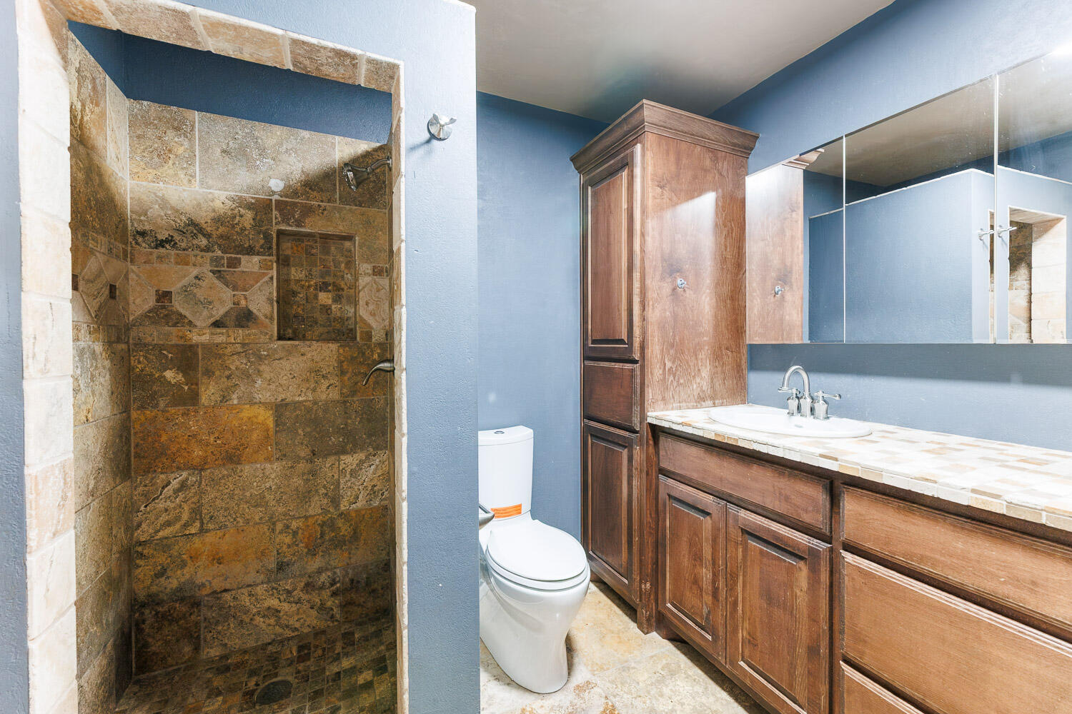 3515 36th Street Lubbock, TX 79413 - Photo 38 of 63 a bathroom with a granite countertop sink toilet and shower