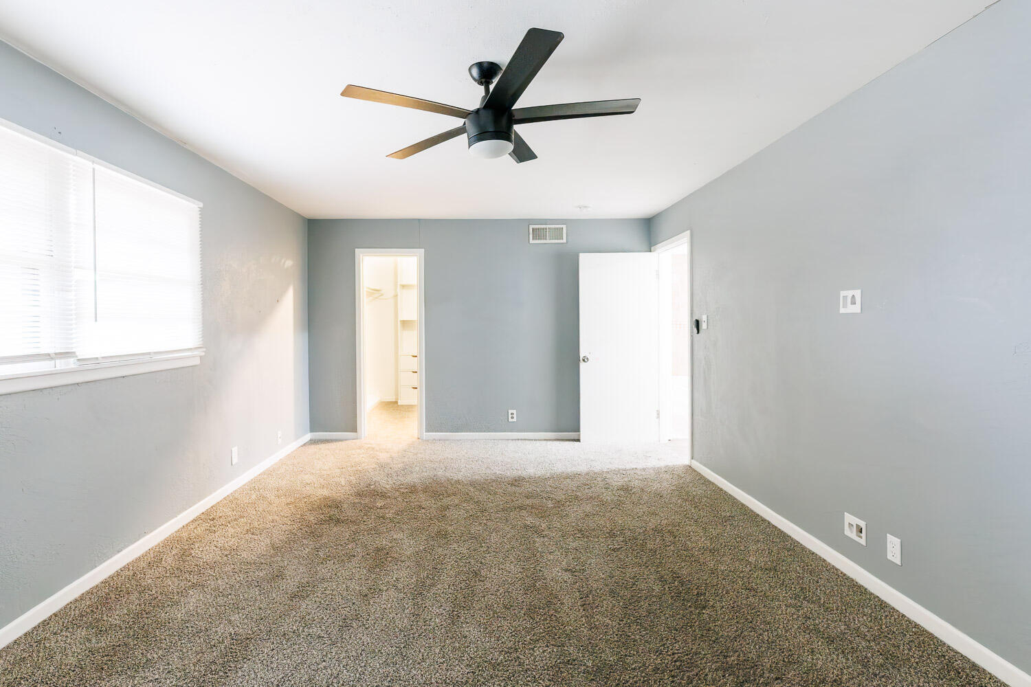 3515 36th Street Lubbock, TX 79413 - Photo 45 of 63 a view of a livingroom with a ceiling fan and window