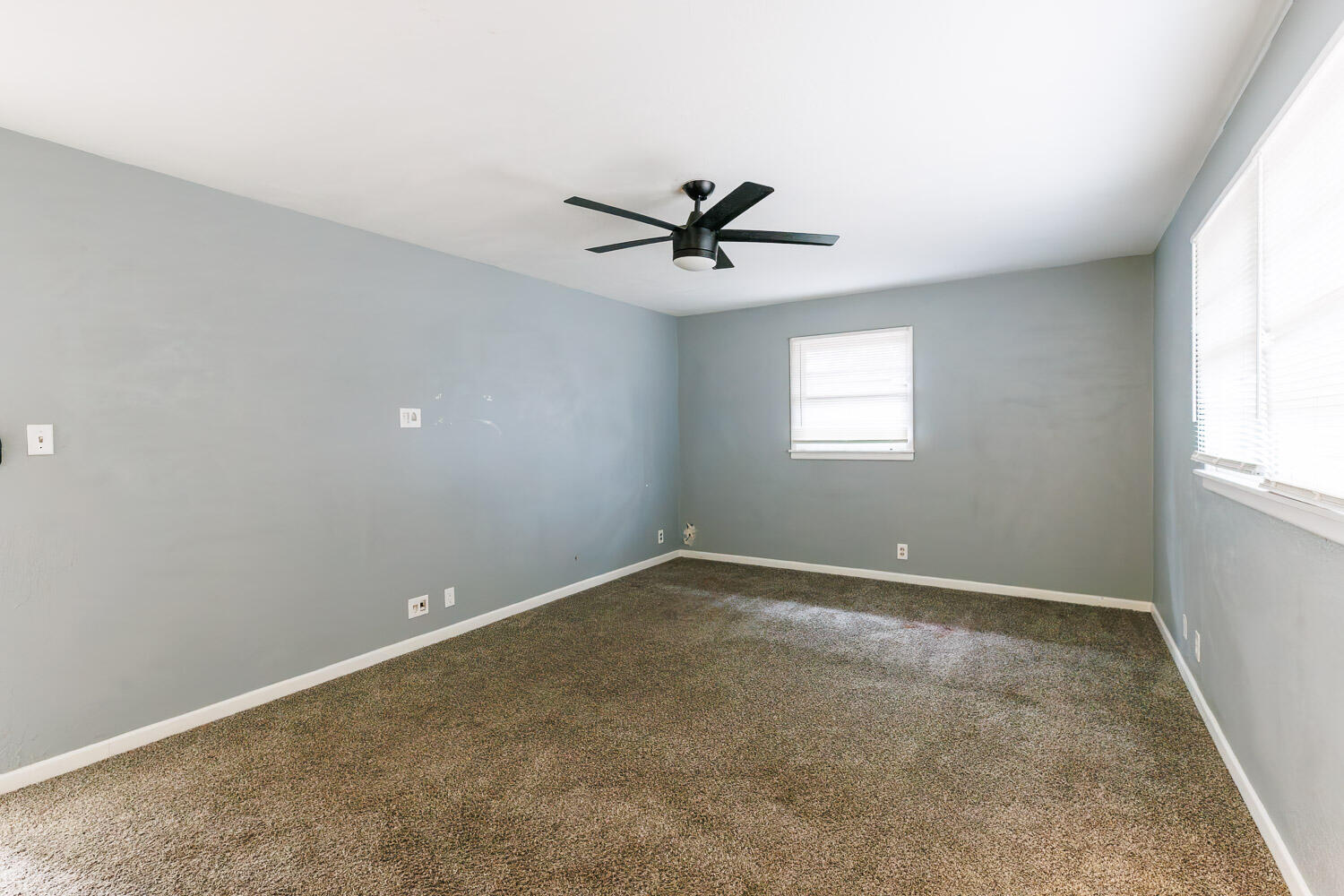 3515 36th Street Lubbock, TX 79413 - Photo 46 of 63 an empty room with windows and ceiling fan