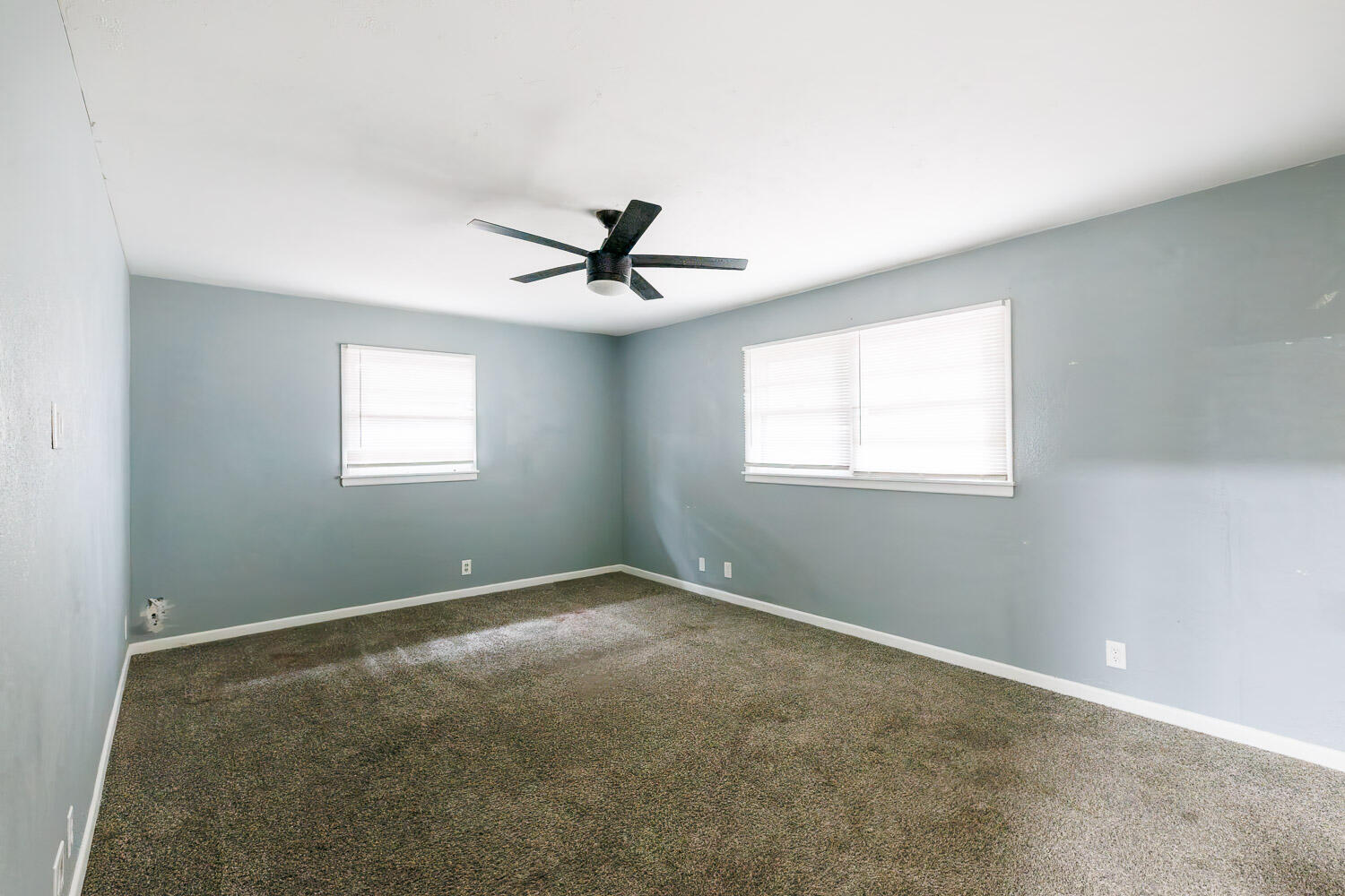 3515 36th Street Lubbock, TX 79413 - Photo 47 of 63 a view of a livingroom with a ceiling fan and window
