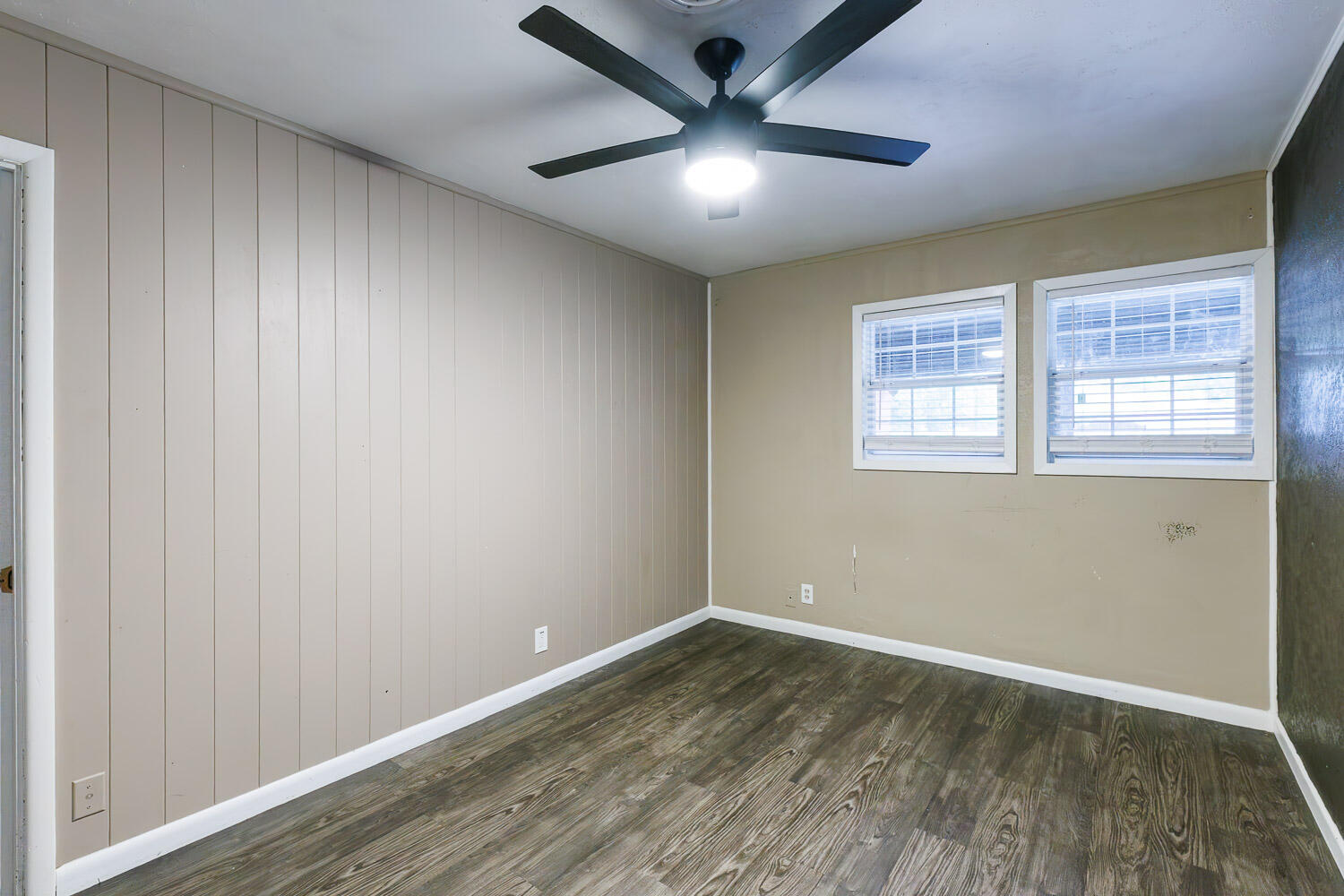 3515 36th Street Lubbock, TX 79413 - Photo 57 of 63 an empty room with wooden floor and windows