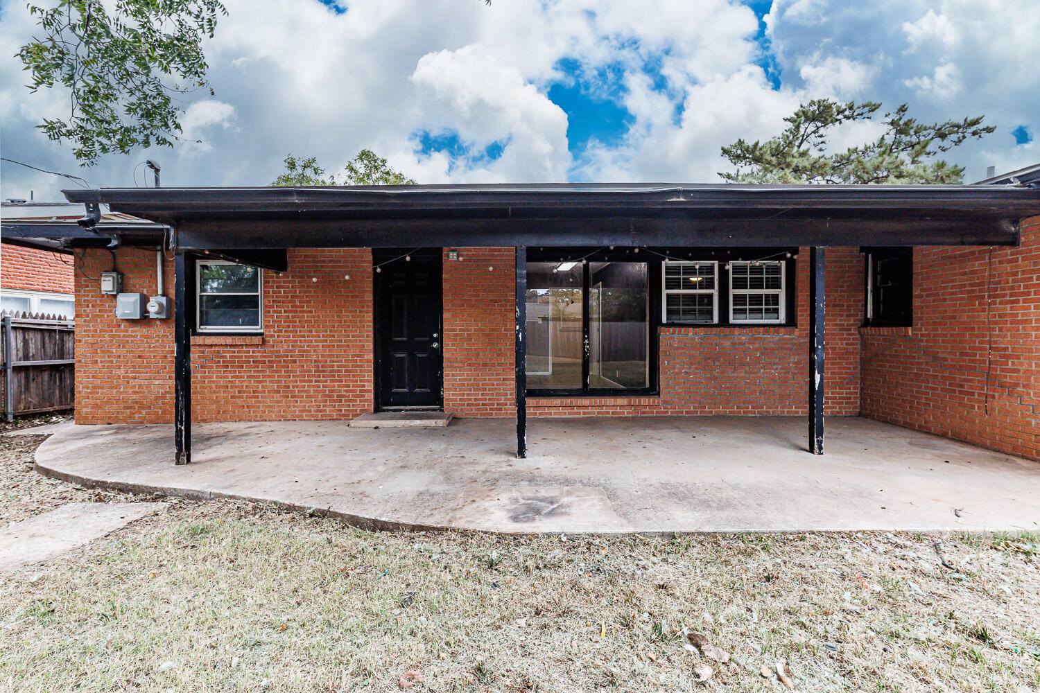 3515 36th Street Lubbock, TX 79413 - Photo 60 of 63 a view of a house with a wooden fence