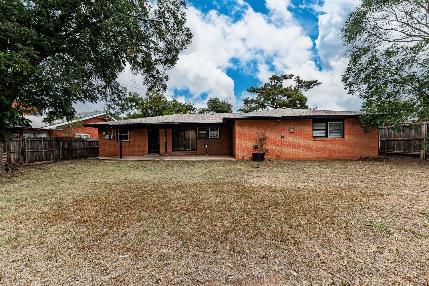 3515 36th Street Lubbock, TX 79413 - Photo 62 of 63 a front view of house with a garden