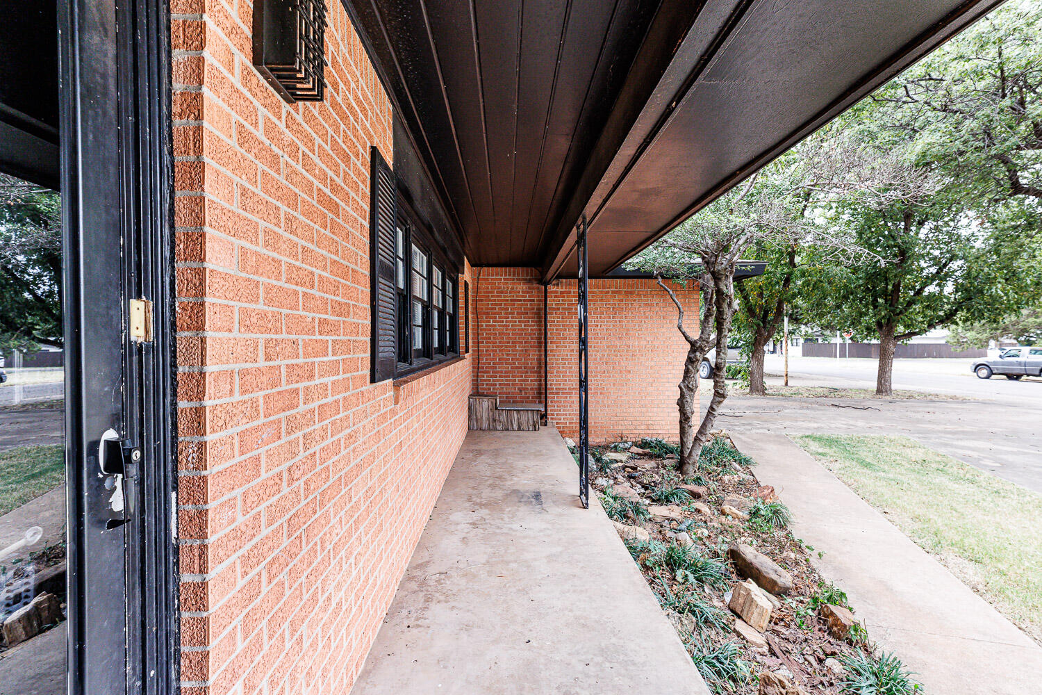 3515 36th Street Lubbock, TX 79413 - Photo 7 of 63 a view of a pathway of a house with a backyard
