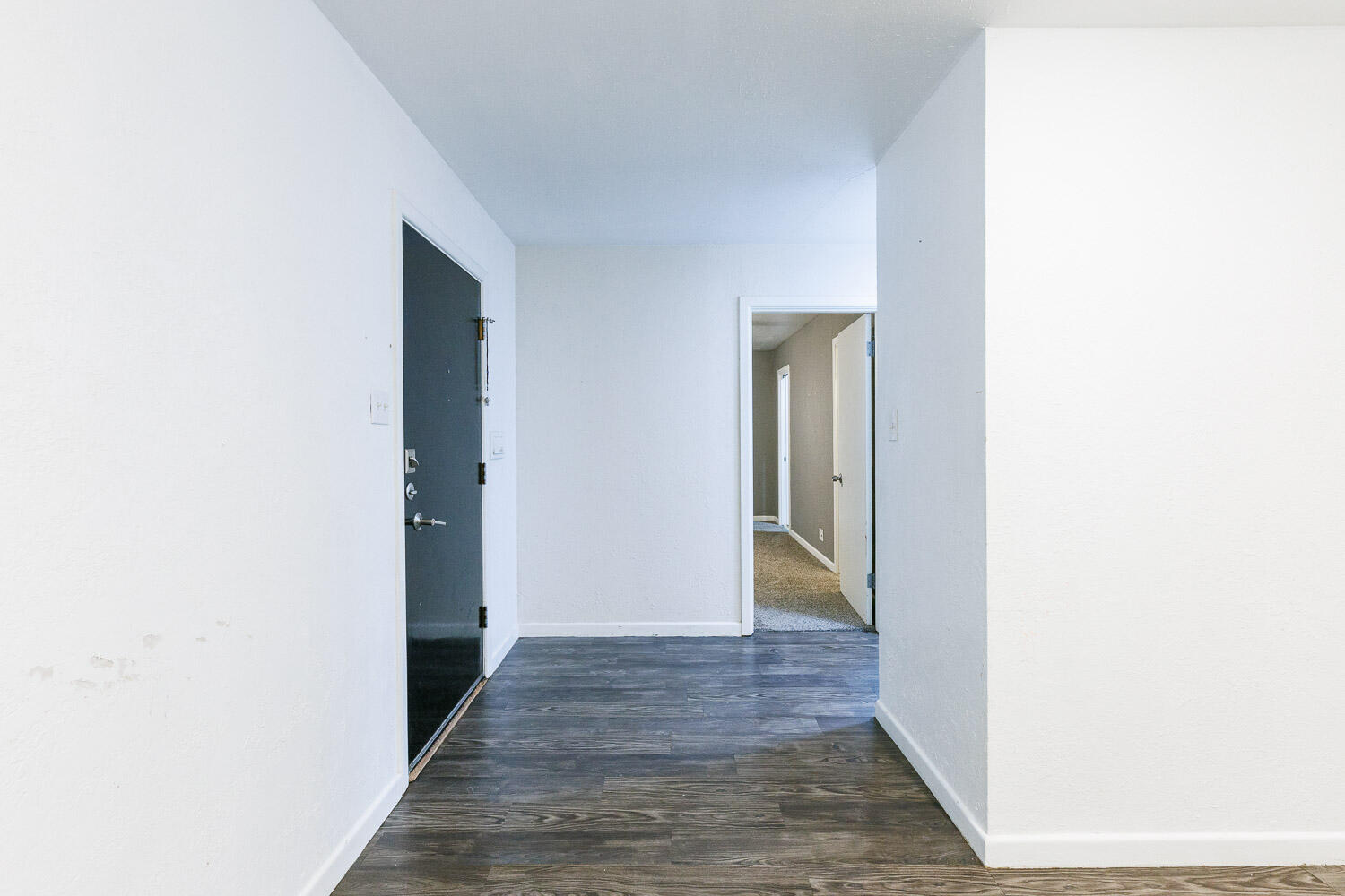 3515 36th Street Lubbock, TX 79413 - Photo 9 of 63 a view of a hallway with wooden floor