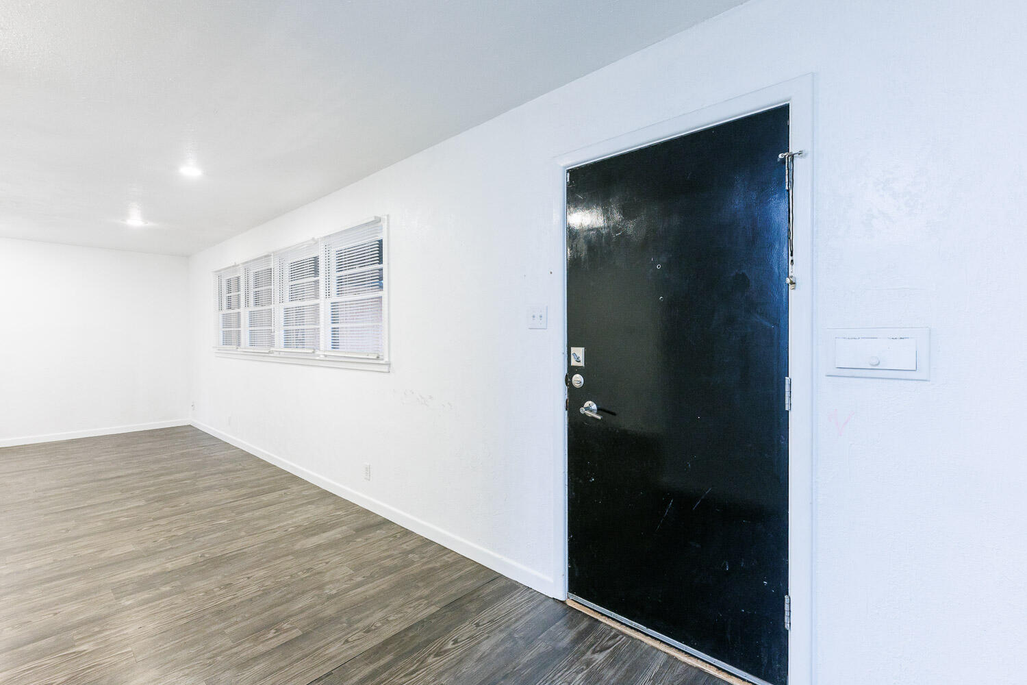 3515 36th Street Lubbock, TX 79413 - Photo 10 of 63 an empty room with wooden floor closet and windows