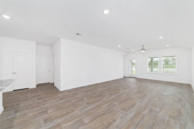 a view of a house with backyard and garden