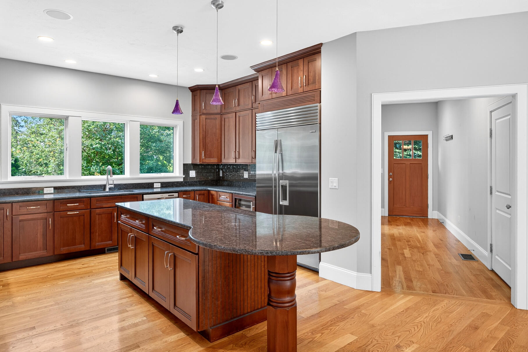 234 Cairn Ridge Road East Falmouth, MA 02536 - Photo 11 of 41 a kitchen with kitchen island granite countertop a sink stove and wooden cabinets