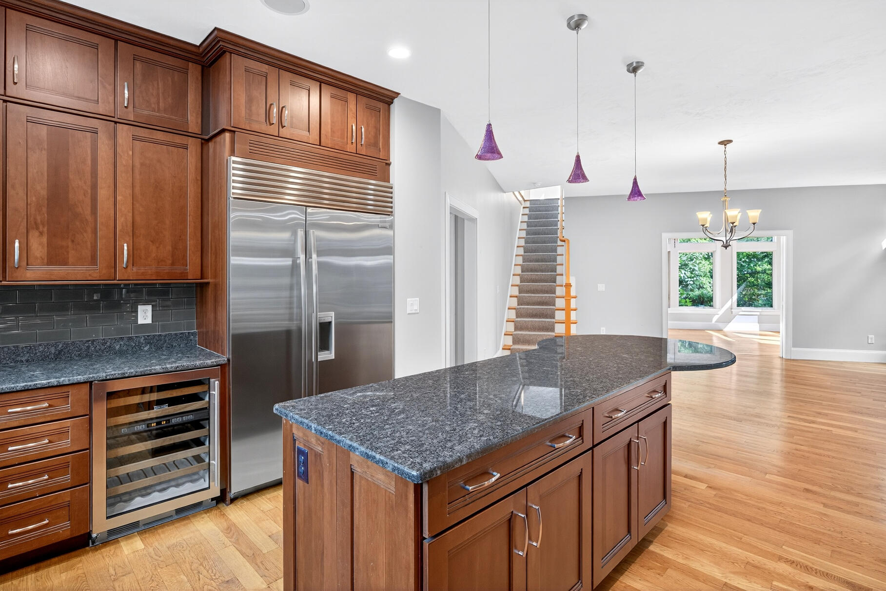 234 Cairn Ridge Road East Falmouth, MA 02536 - Photo 12 of 41 a kitchen with granite countertop a stove a sink and a wooden floors