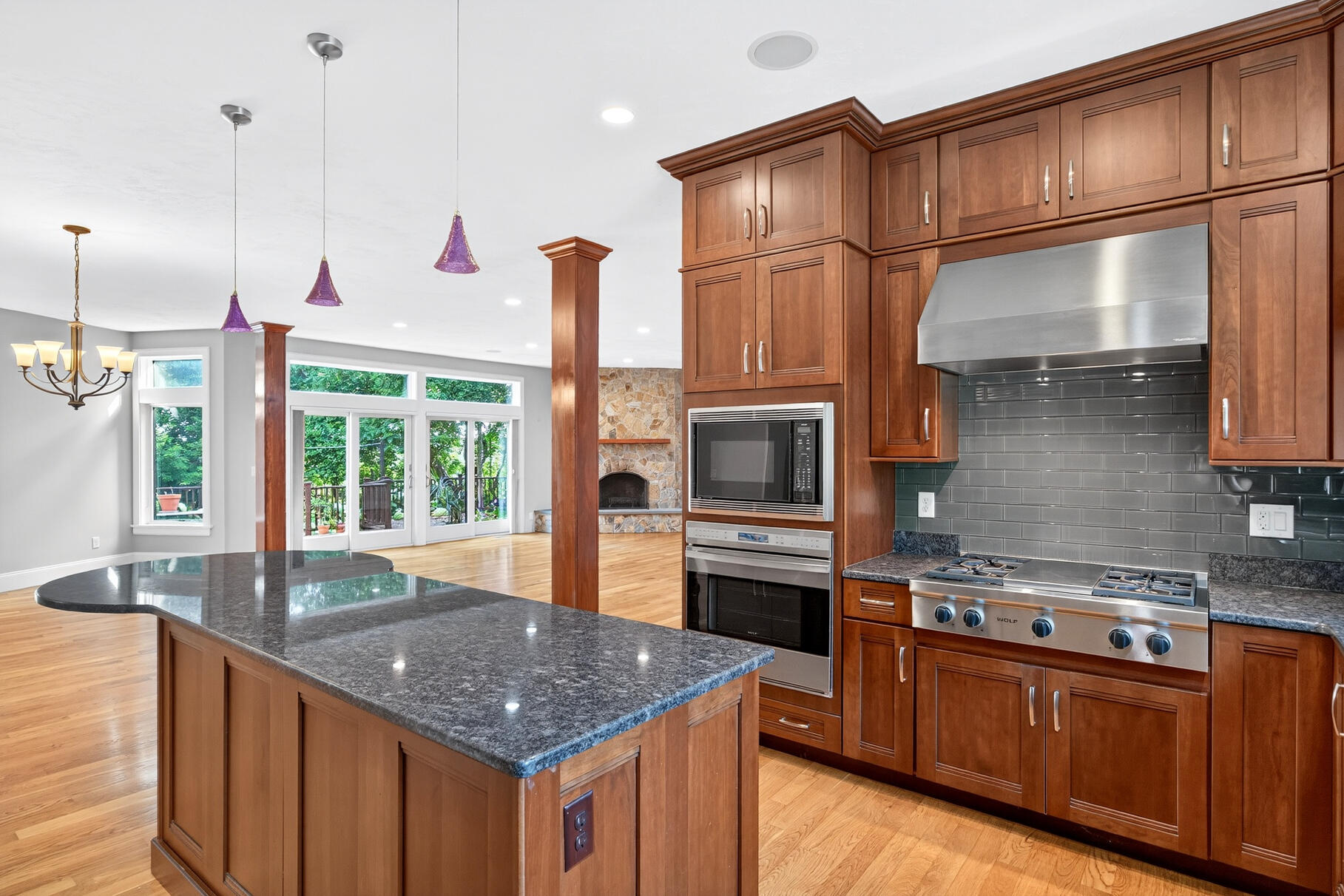 234 Cairn Ridge Road East Falmouth, MA 02536 - Photo 13 of 41 a kitchen with stainless steel appliances granite countertop a sink a stove and a wooden floors