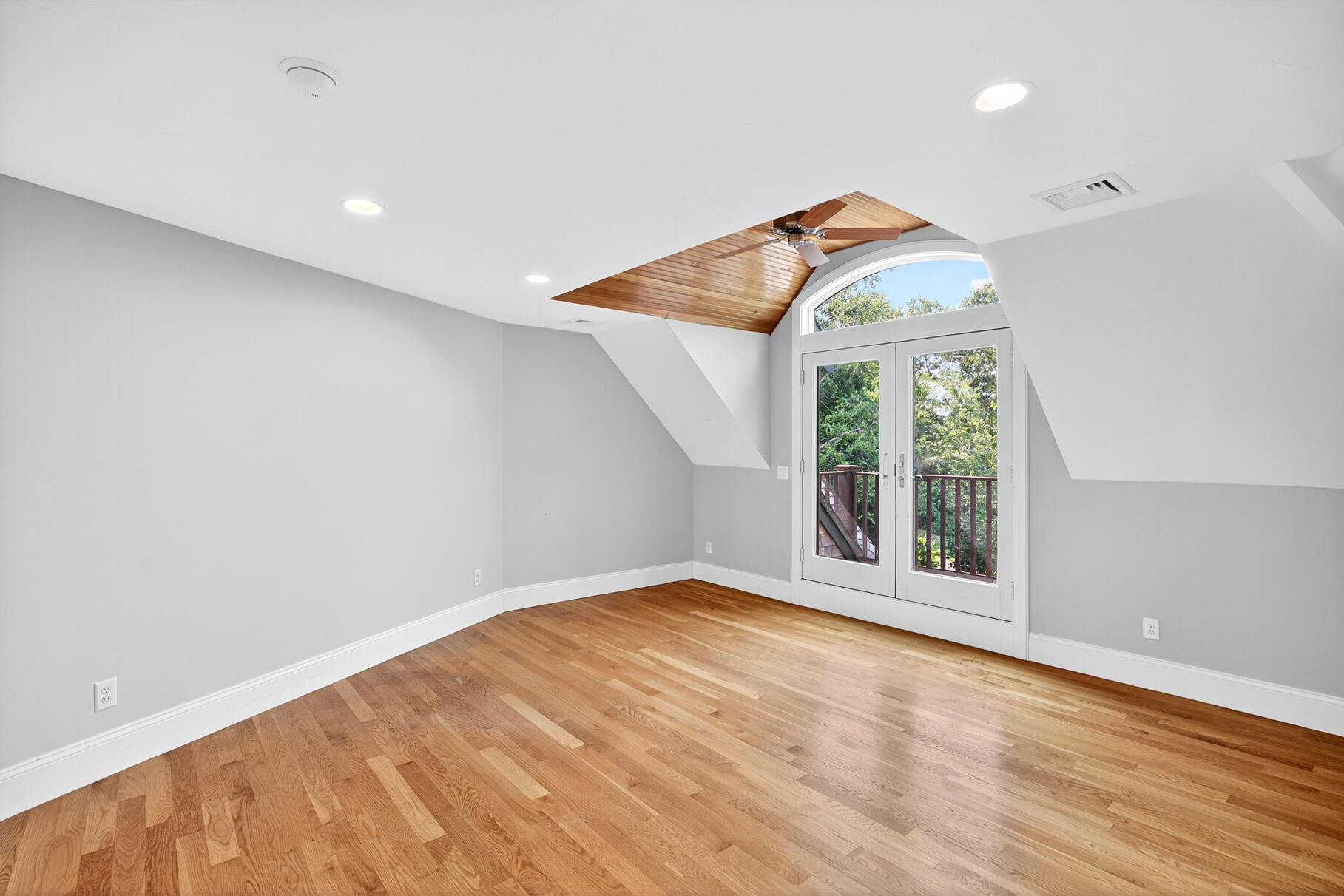 234 Cairn Ridge Road East Falmouth, MA 02536 - Photo 22 of 41 an empty room with wooden floor and windows