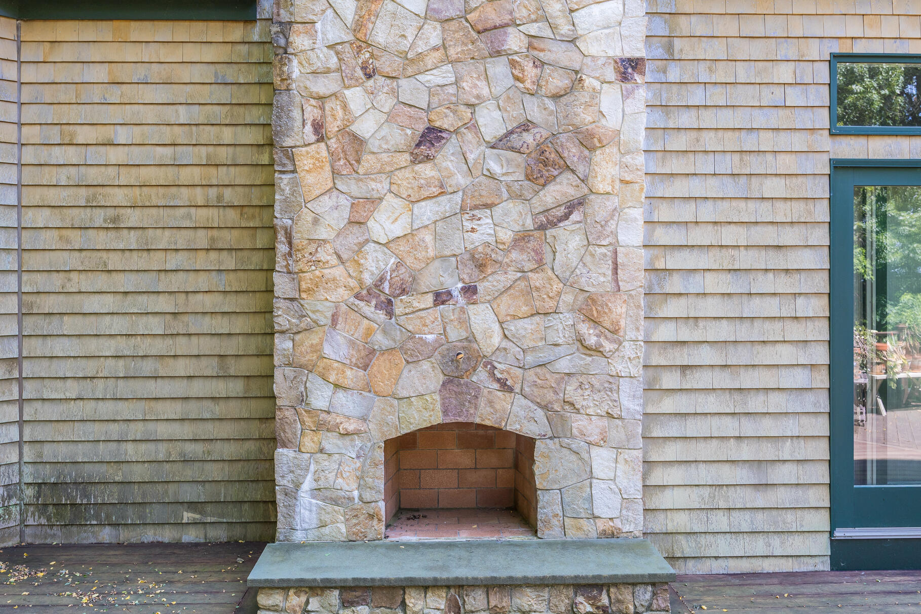 234 Cairn Ridge Road East Falmouth, MA 02536 - Photo 30 of 41 a brick building with a bench
