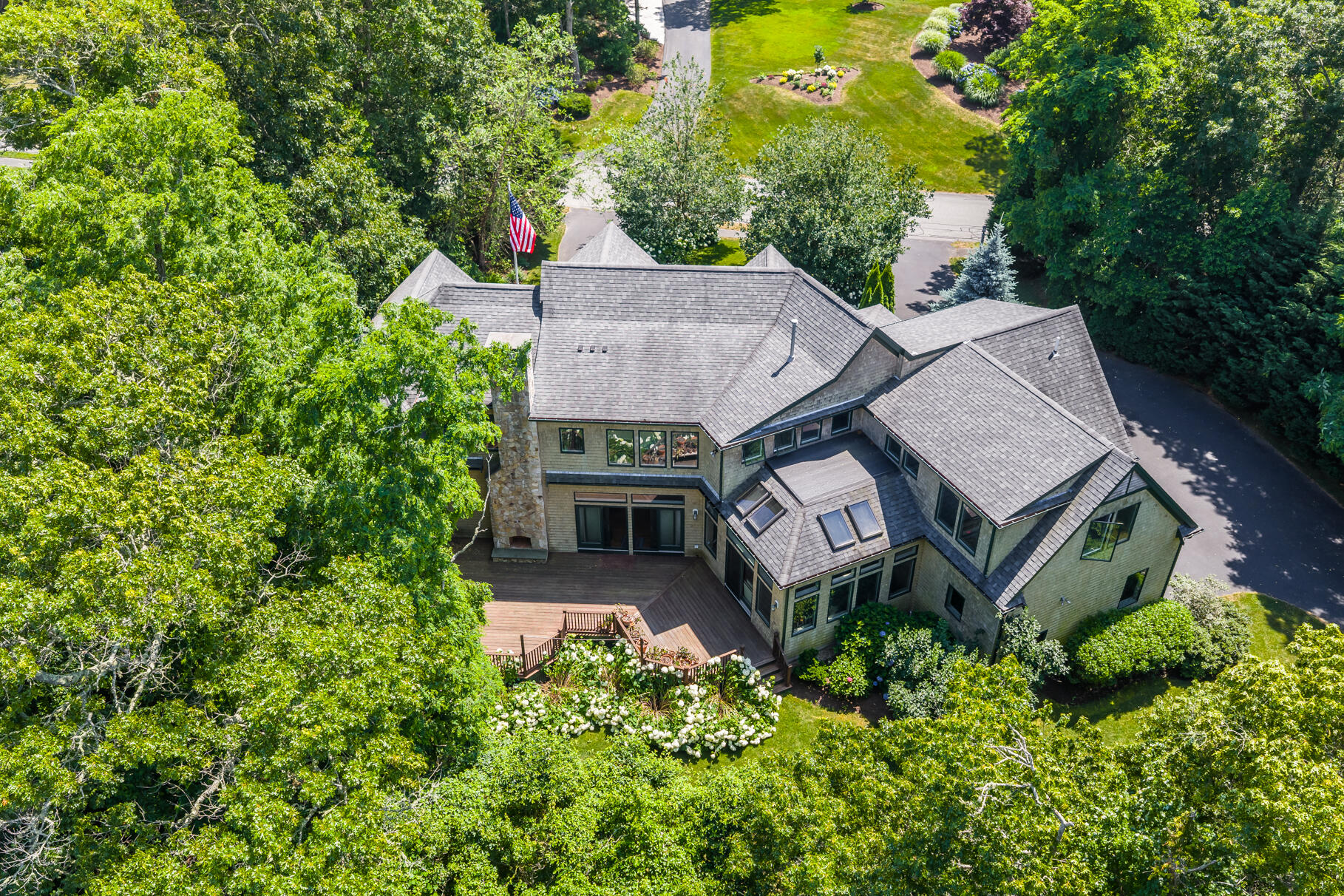 234 Cairn Ridge Road East Falmouth, MA 02536 - Photo 3 of 41 an aerial view of a house with a garden and plants