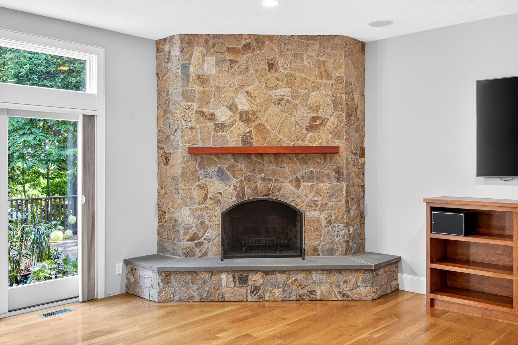 234 Cairn Ridge Road East Falmouth, MA 02536 - Photo 7 of 41 a living room with a fireplace and a flat screen tv