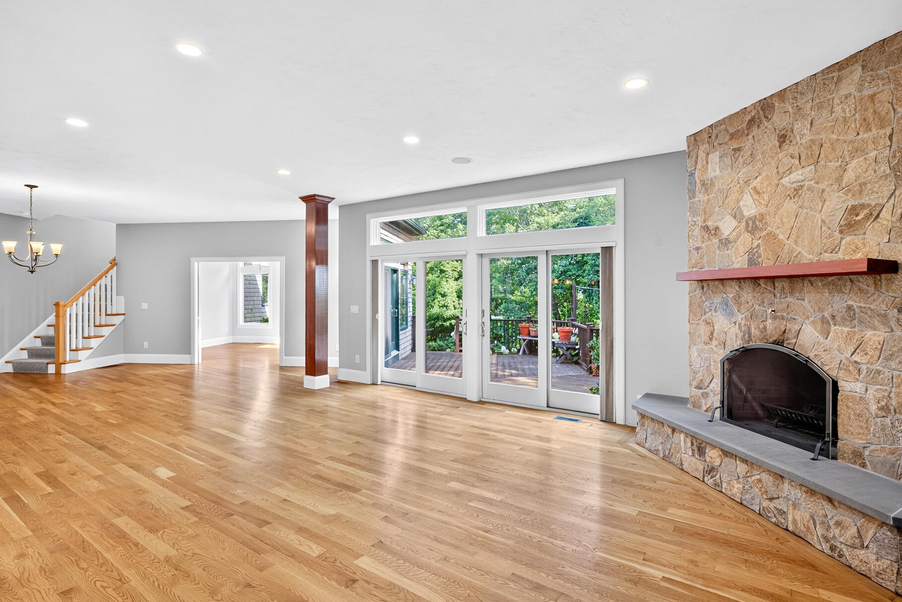 234 Cairn Ridge Road East Falmouth, MA 02536 - Photo 10 of 41 a view of an empty room with wooden floor and a fireplace