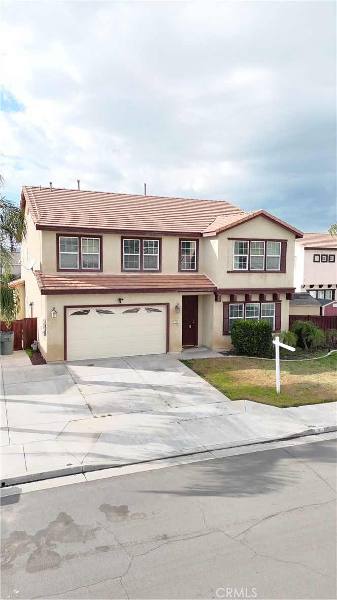 a view of a house next to a big yard