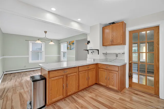 a kitchen with stainless steel appliances granite countertop a sink and dishwasher with wooden floor