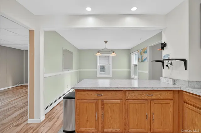 a kitchen with cabinets and window