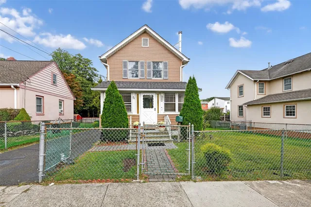 front view of a house with a yard