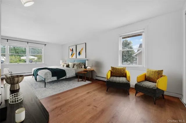 a bedroom with furniture and a window