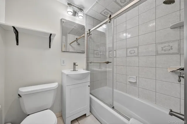 a bathroom with a toilet a sink and bathtub