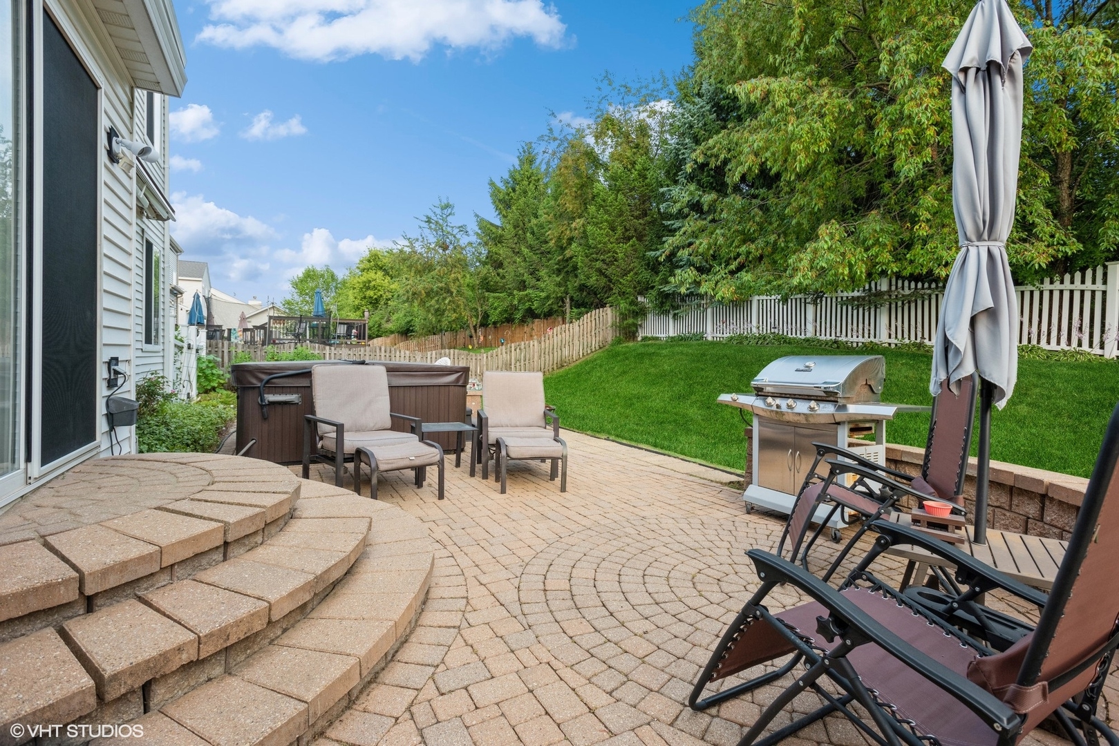 14505 Etchingham Drive Lockport, IL 60441 - Photo 19 of 19 a view of a patio with table and chairs potted plants and a palm tree