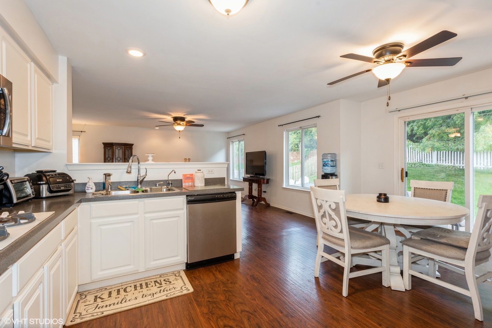 14505 Etchingham Drive Lockport, IL 60441 - Photo 6 of 19 a kitchen with a table chairs stove and cabinets
