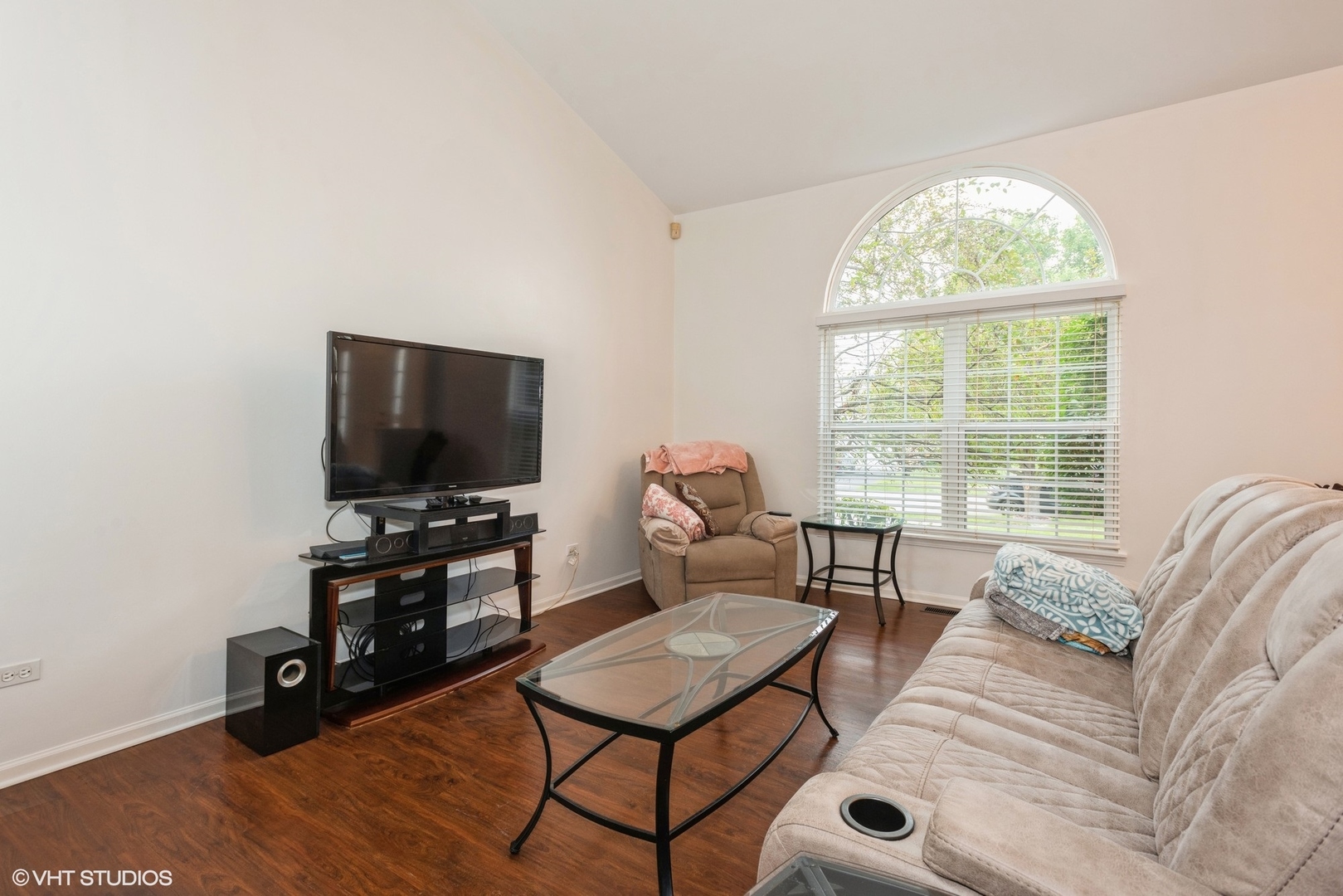 14505 Etchingham Drive Lockport, IL 60441 - Photo 7 of 19 a living room with furniture a flat screen tv and a large window