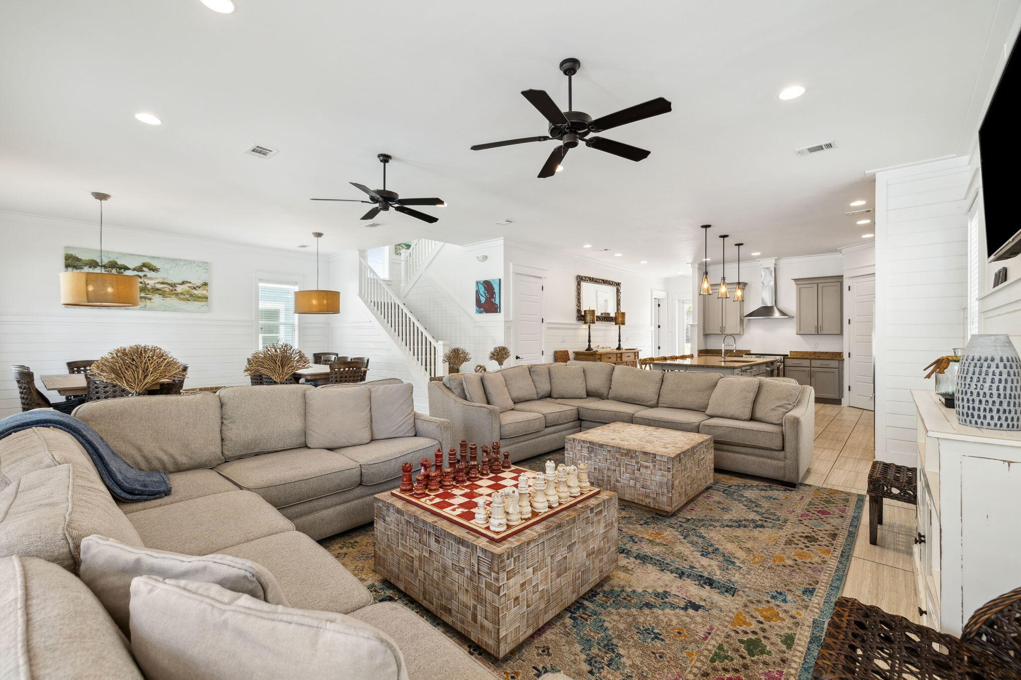 85 Santa Clara Street Santa Rosa Beach, FL 32459 - Photo 18 of 54 a living room with furniture a ceiling fan and a rug