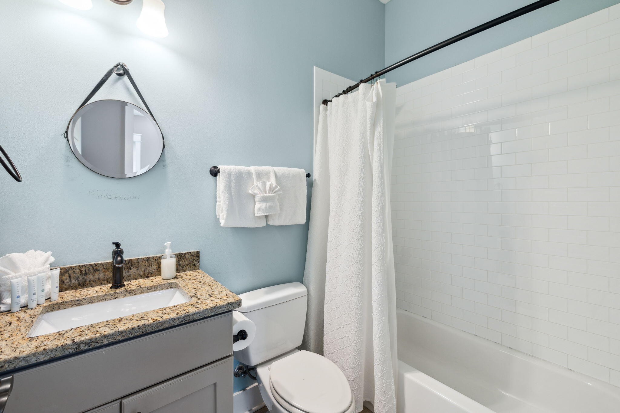85 Santa Clara Street Santa Rosa Beach, FL 32459 - Photo 50 of 54 a bathroom with a granite countertop sink mirror vanity and toilet