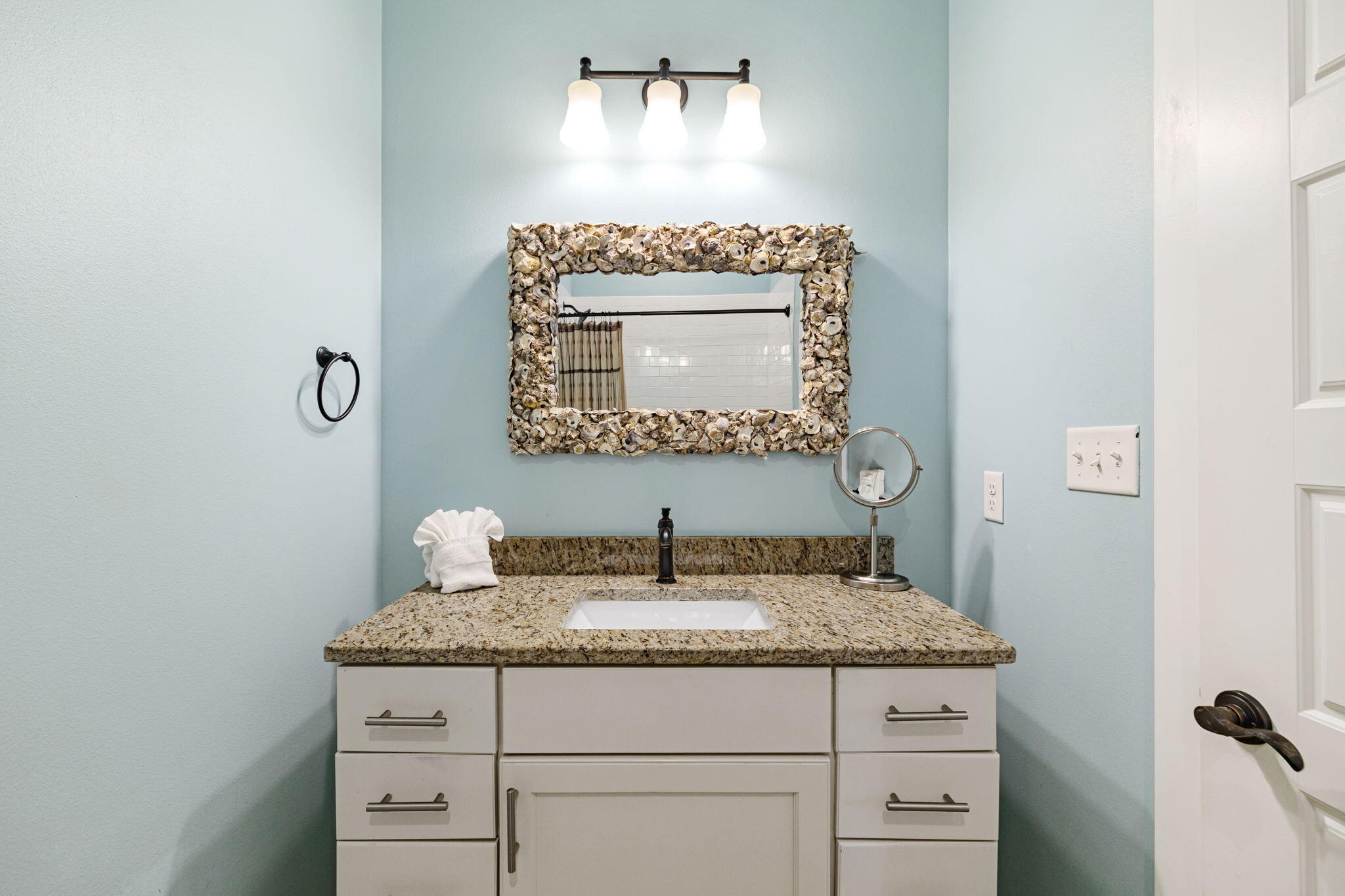 85 Santa Clara Street Santa Rosa Beach, FL 32459 - Photo 53 of 54 a bathroom with a granite countertop sink and a mirror
