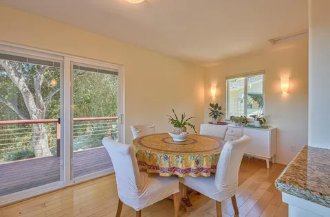 a view of an empty room with a fireplace and a window