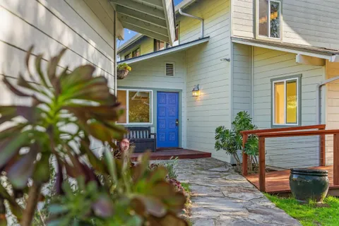a front view of house with outdoor seating