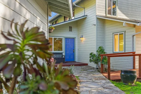 a front view of house with outdoor seating