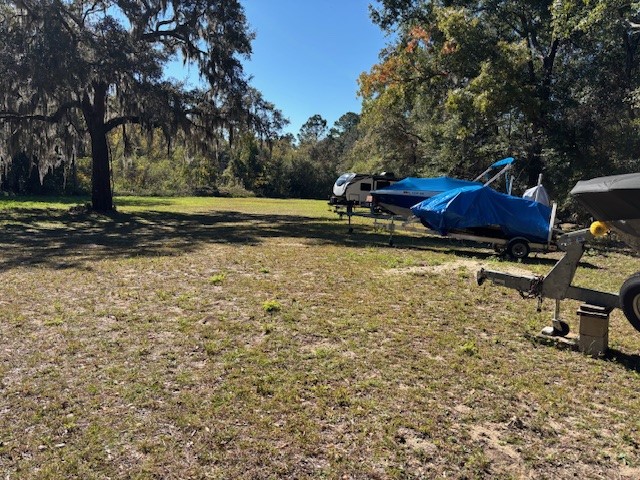 0 Lents Road Yulee, FL 32097 - Photo 1 of 8 a view of a yard with wooden fence