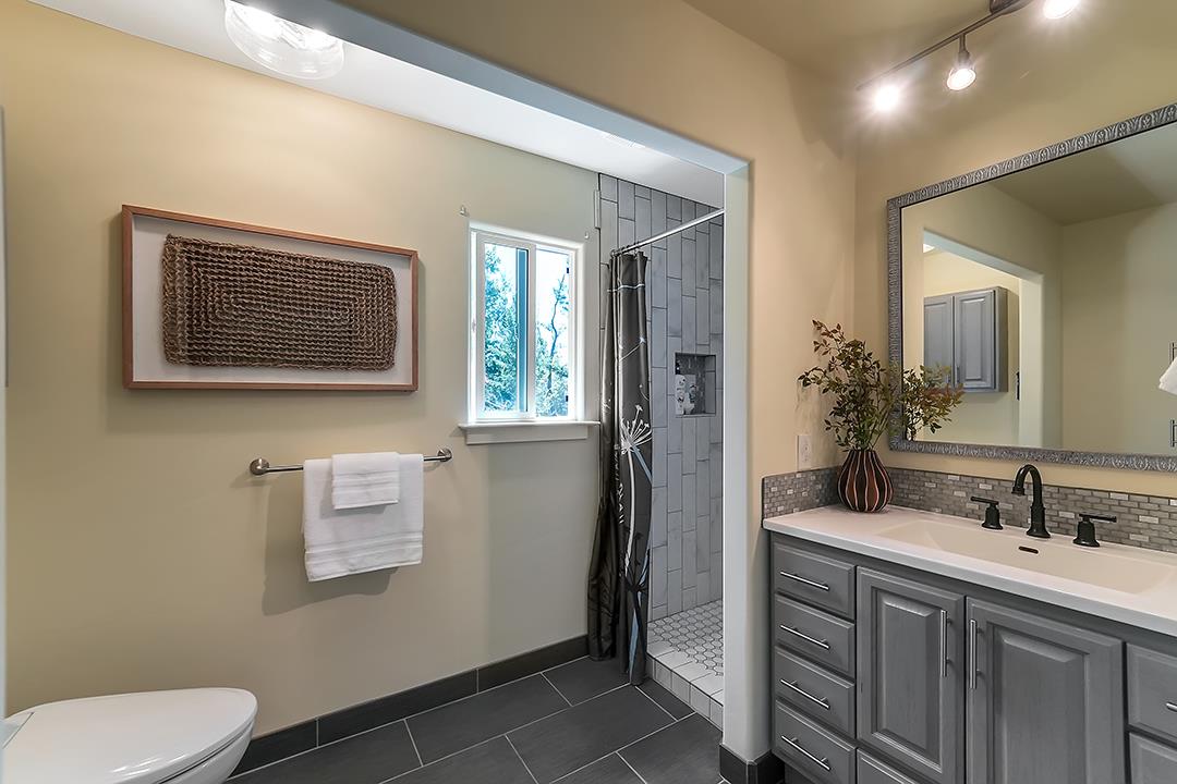 14136 Long Ridge Road Los Gatos, CA 95033 - Photo 15 of 75 a bathroom with a toilet sink vanity and mirror