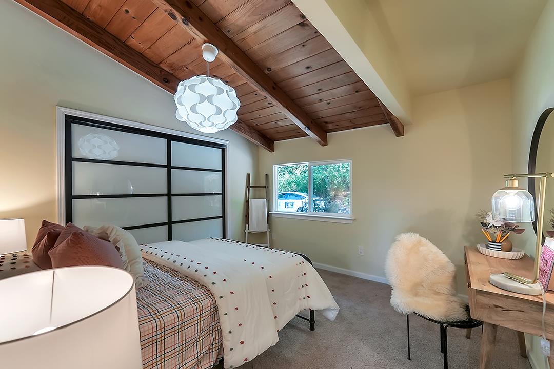 14136 Long Ridge Road Los Gatos, CA 95033 - Photo 17 of 75 a bedroom with bed and a window