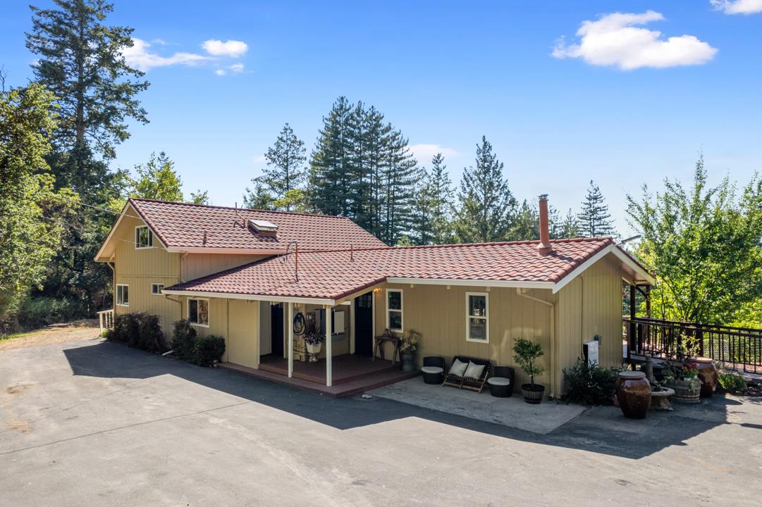 14136 Long Ridge Road Los Gatos, CA 95033 - Photo 2 of 75 a view of a house with a yard patio and outdoor seating
