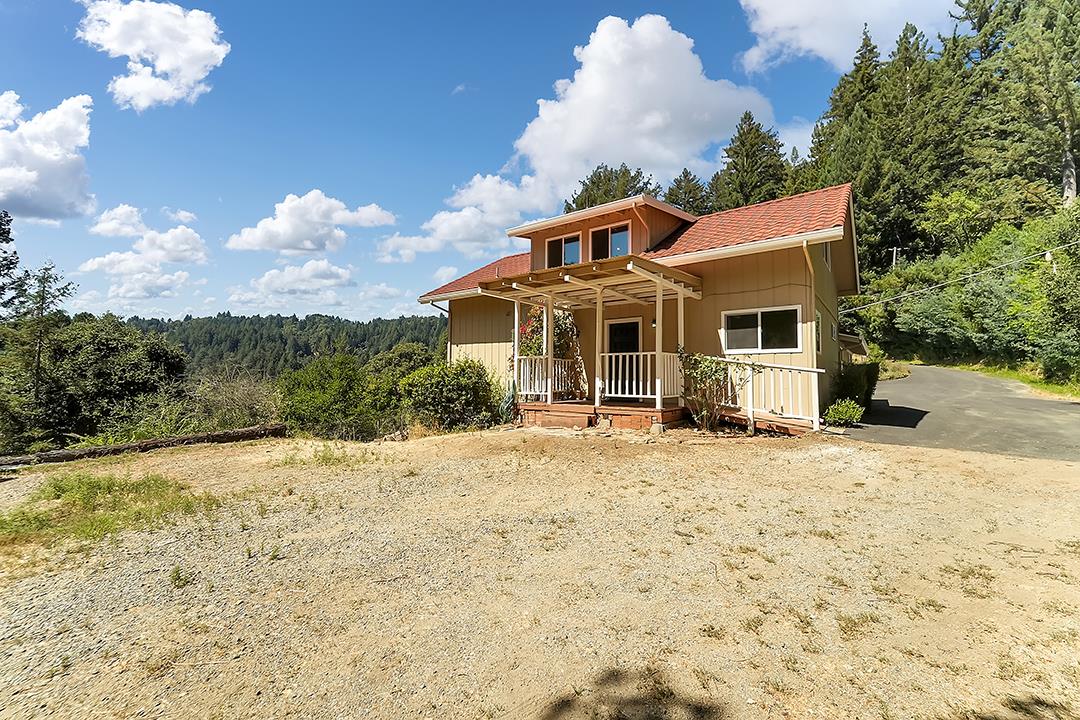 14136 Long Ridge Road Los Gatos, CA 95033 - Photo 37 of 75 a front view of a house with a yard and trees