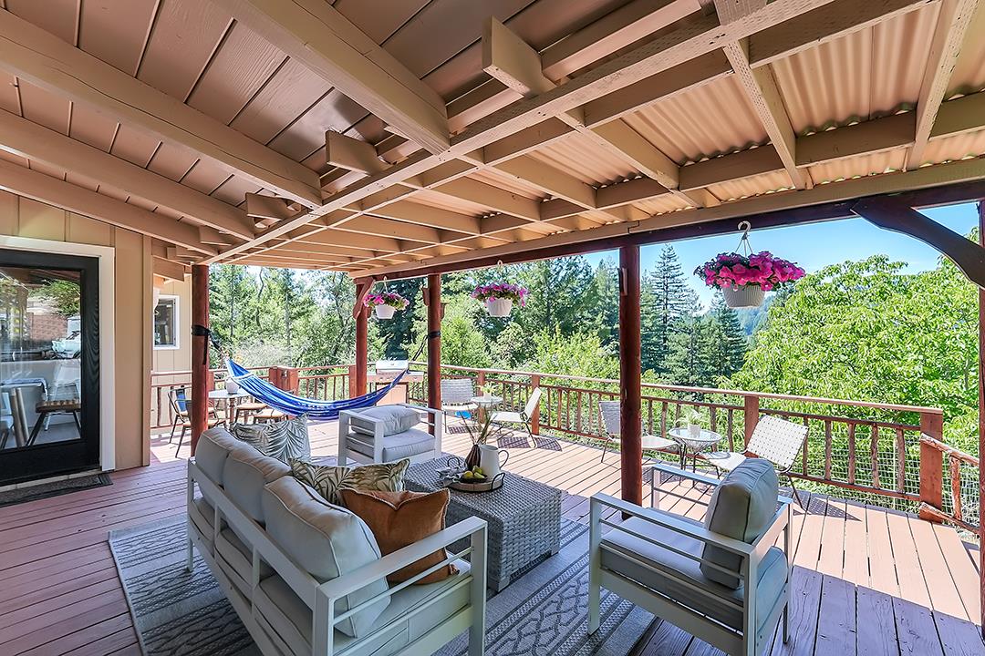 14136 Long Ridge Road Los Gatos, CA 95033 - Photo 47 of 75 a view of a patio with couches chairs and wooden floor