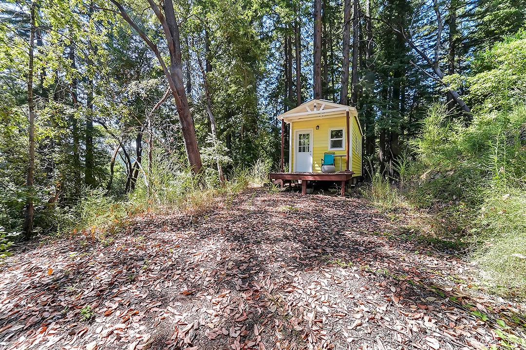 14136 Long Ridge Road Los Gatos, CA 95033 - Photo 49 of 75 a backyard of a house with a table and chair