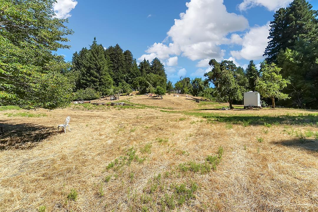 14136 Long Ridge Road Los Gatos, CA 95033 - Photo 57 of 75 a view of a yard with swimming pool and trees in the background