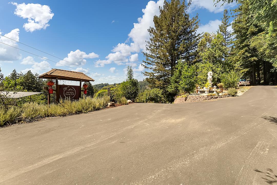 14136 Long Ridge Road Los Gatos, CA 95033 - Photo 63 of 75 a front view of a house with a yard and fountain