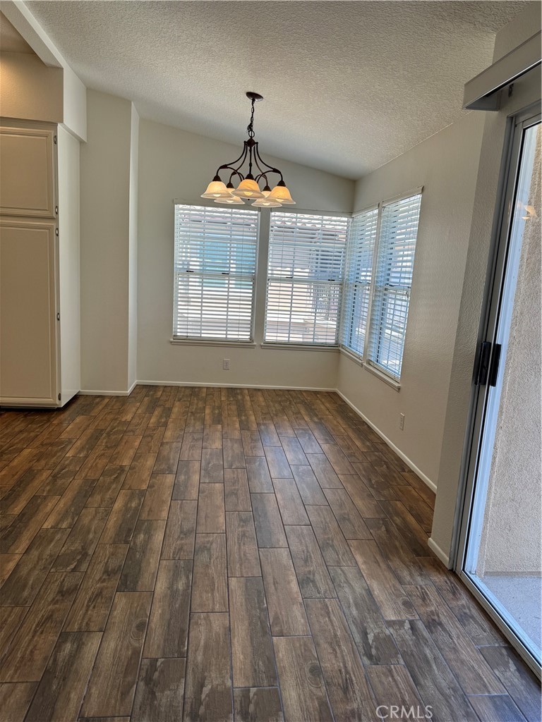 125 Pasto Rico Rancho Santa Margarita, CA 92688 - Photo 5 of 14 a view of an empty room with wooden floor and a window