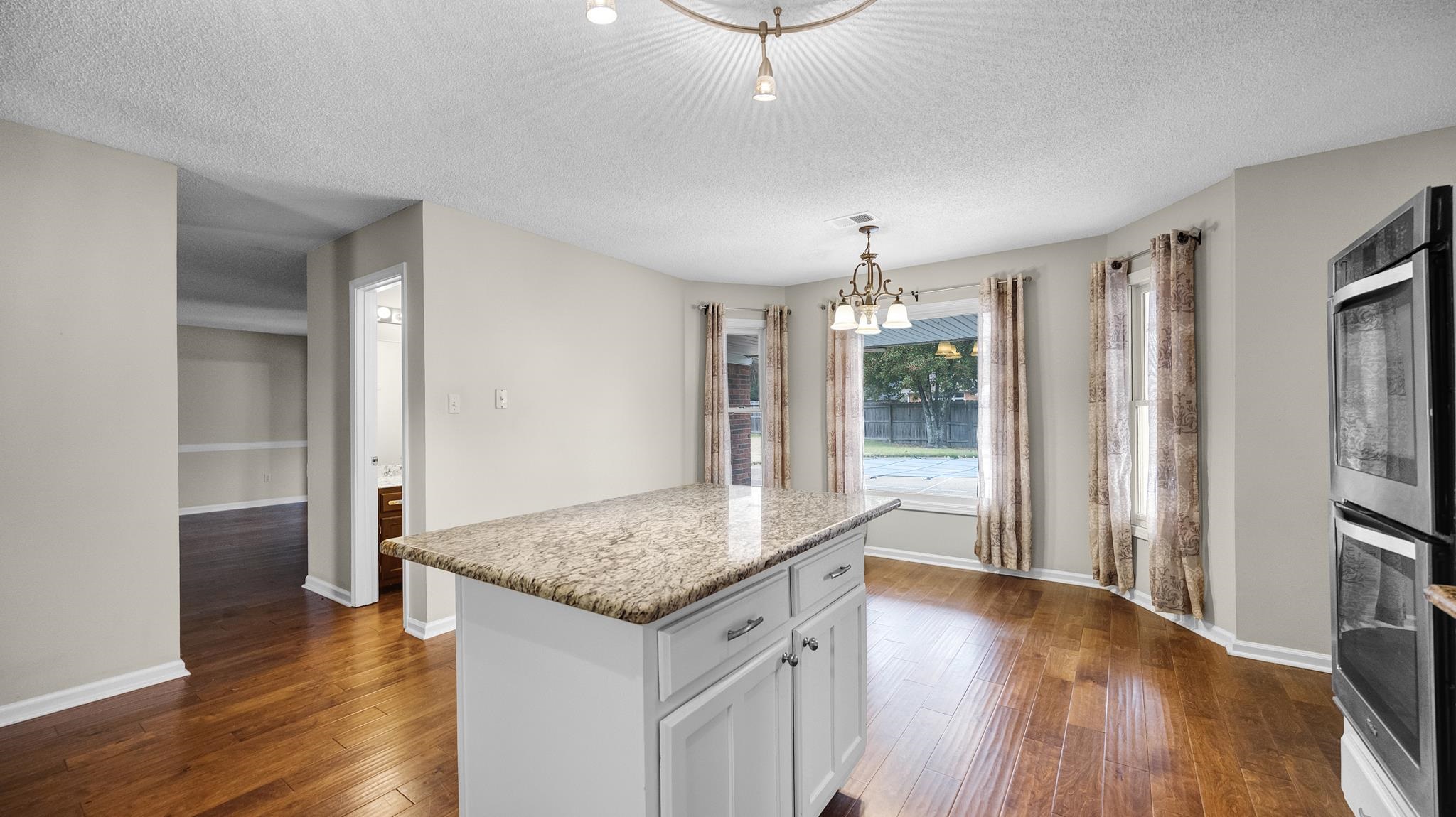 1105 Winrose Drive Collierville, TN 38017 - Photo 17 of 37 a kitchen with stainless steel appliances granite countertop a refrigerator a sink and a stove